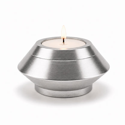 Bougie souvenir argenté en acier inoxydable avec design moderne et minimaliste Mementery