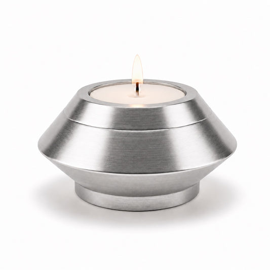 Bougie souvenir argenté en acier inoxydable avec design moderne et minimaliste Mementery