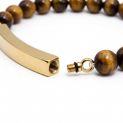 Détail de la barre en acier inoxydable du bracelet pierre du souvenir marron metal-jaune avec système d’ouverture sécurisé