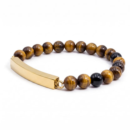 Vue 3/4 du bracelet pierre du souvenir marron metal-jaune avec perles effet pierre marron et barre