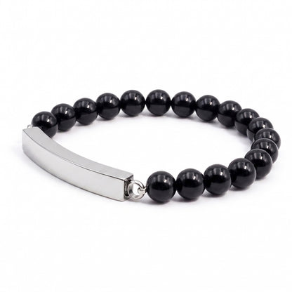 Vue 3/4 du bracelet pierre du souvenir noir metal-gris avec perles noires et barre 