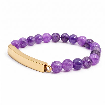 Vue 3/4 du bracelet pierre du souvenir violet metal-jaune avec perles effet pierre violette et barre