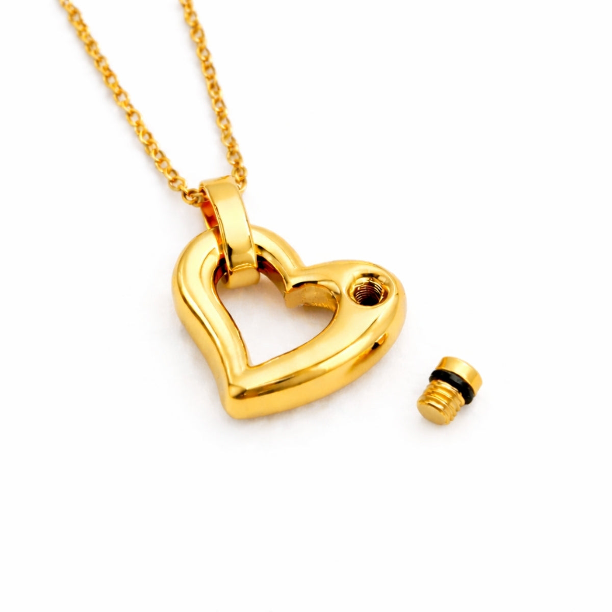 Détail du compartiment interne sécurisé du pendentif cœur éternel urne doré avec fermeture à vis