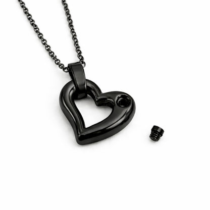 Détail du compartiment interne sécurisé du pendentif cœur éternel urne noir avec fermeture à vis