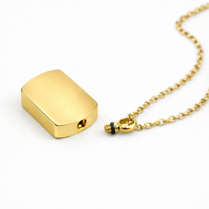 Détail du compartiment interne sécurisé du pendentif Héritage urne doré avec fermeture à vis