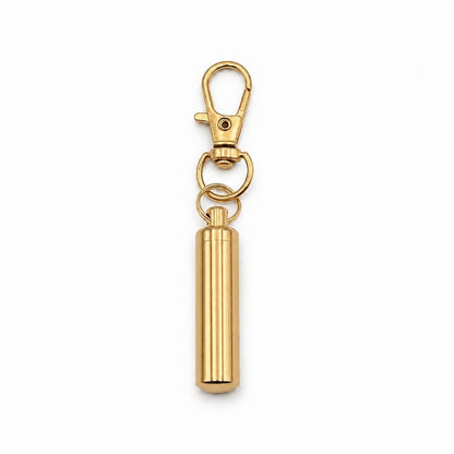 Porte-clés Capsule du Souvenir urne en acier inoxydable doré avec compartiment sécurisé intégré – Mementery