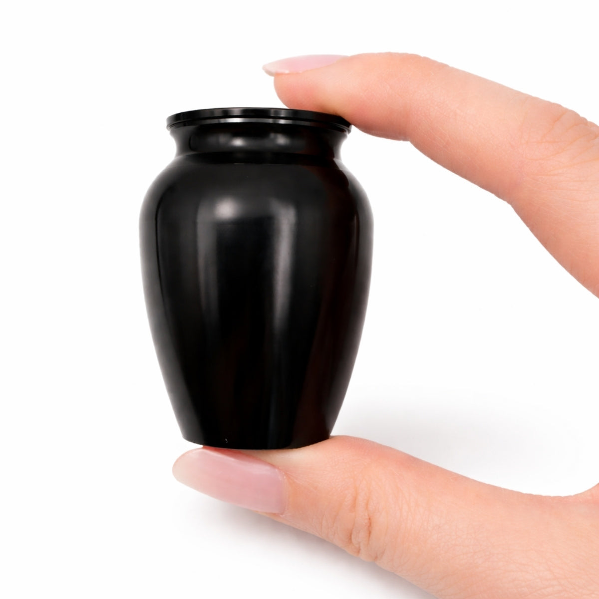 Urne du Souvenir Éternel noir tenue en main, format compact et design sobre