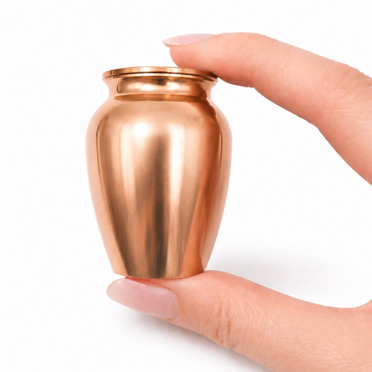 Urne du Souvenir Éternel rose tenue en main, format compact et design sobre